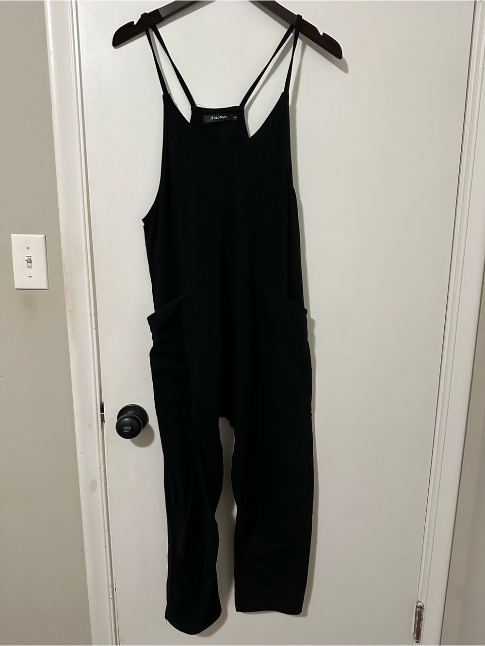 Relaxed Black Strappy Jumpsuit with Front Pockets